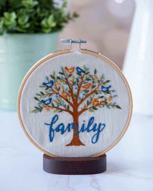 Embroidery hoop with a tree design and 'family' text designed by Deb Strain. Coordinates with Family Tree fabric.