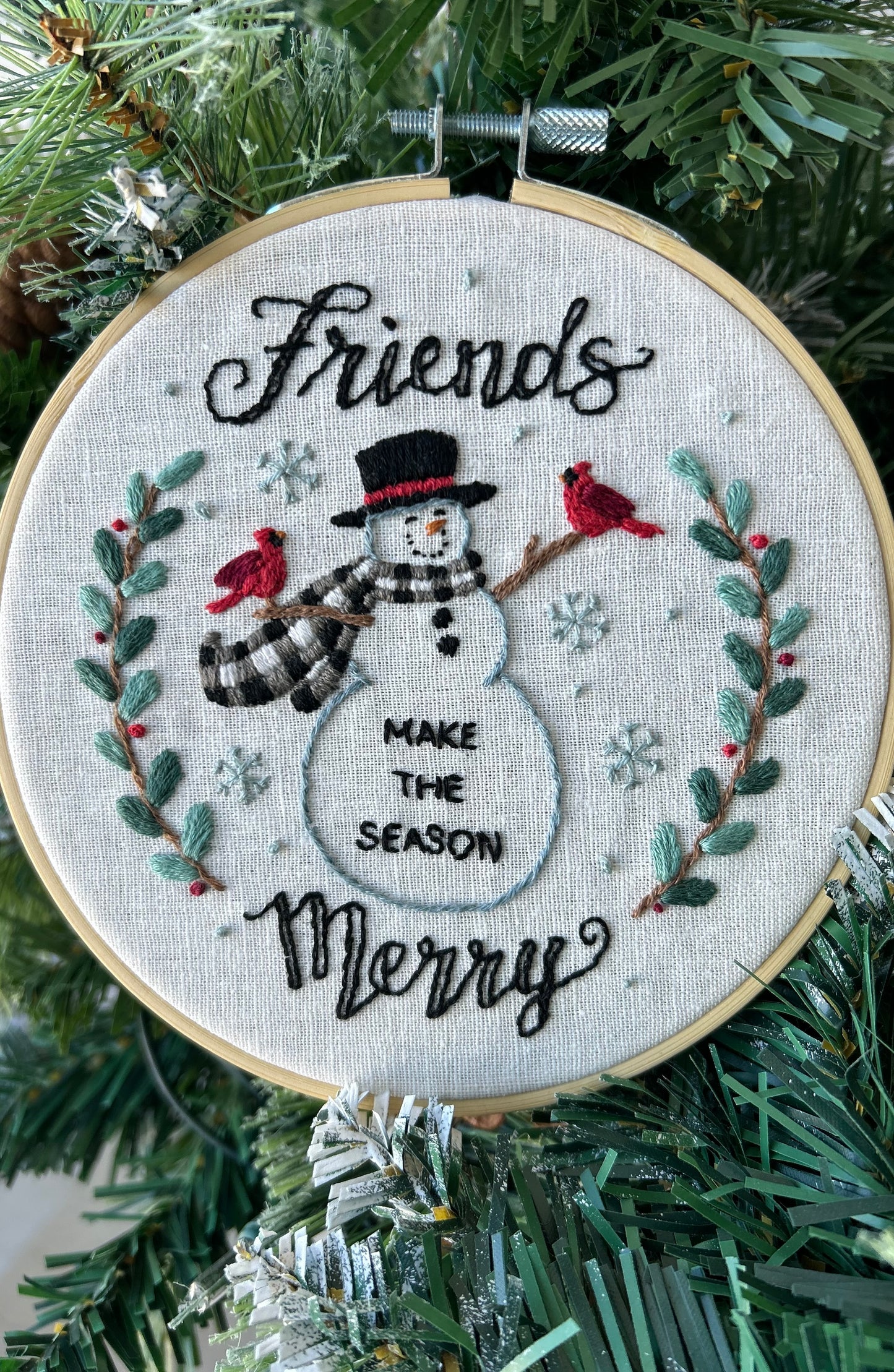 Embroidery Kit  with a snowman design and text 'Friends make the season merry' designed by Deb Strain.