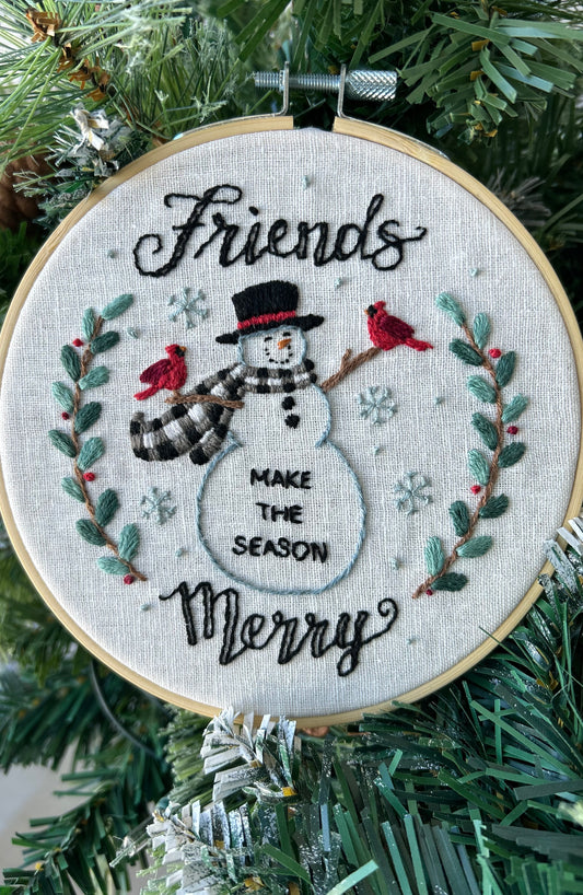Embroidery Kit  with a snowman design and text 'Friends make the season merry' designed by Deb Strain.